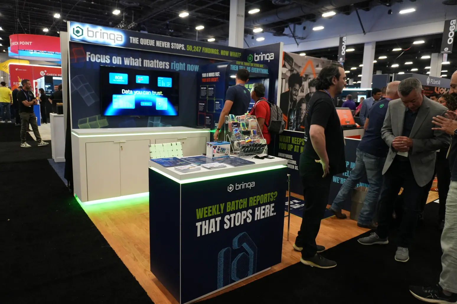 Brinqa, featuring custom designed and built exhibit elements with LED backlit display.