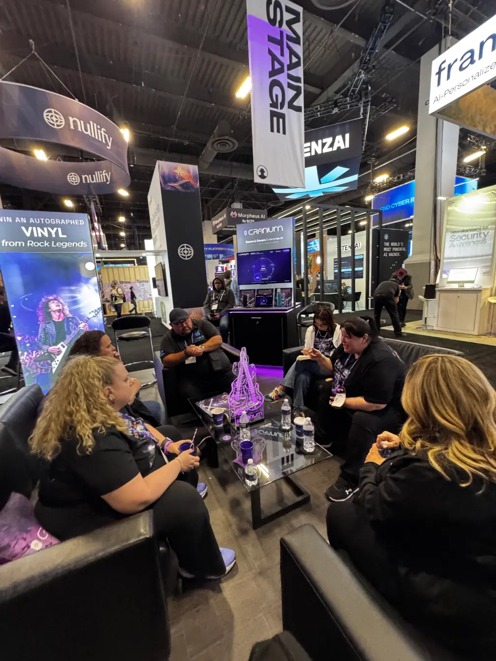 Cranium AI team meeting at their exhibit booth at Black Hat 2026