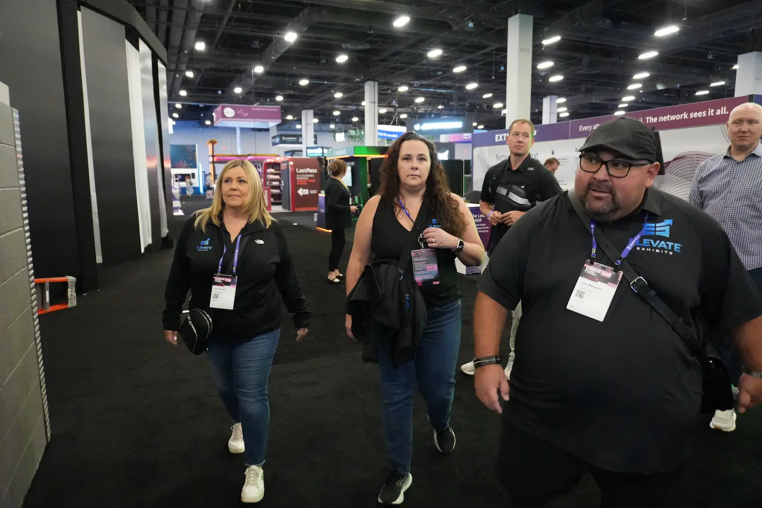 Elevate Exhibits team walking the Black Hat exhibition floor