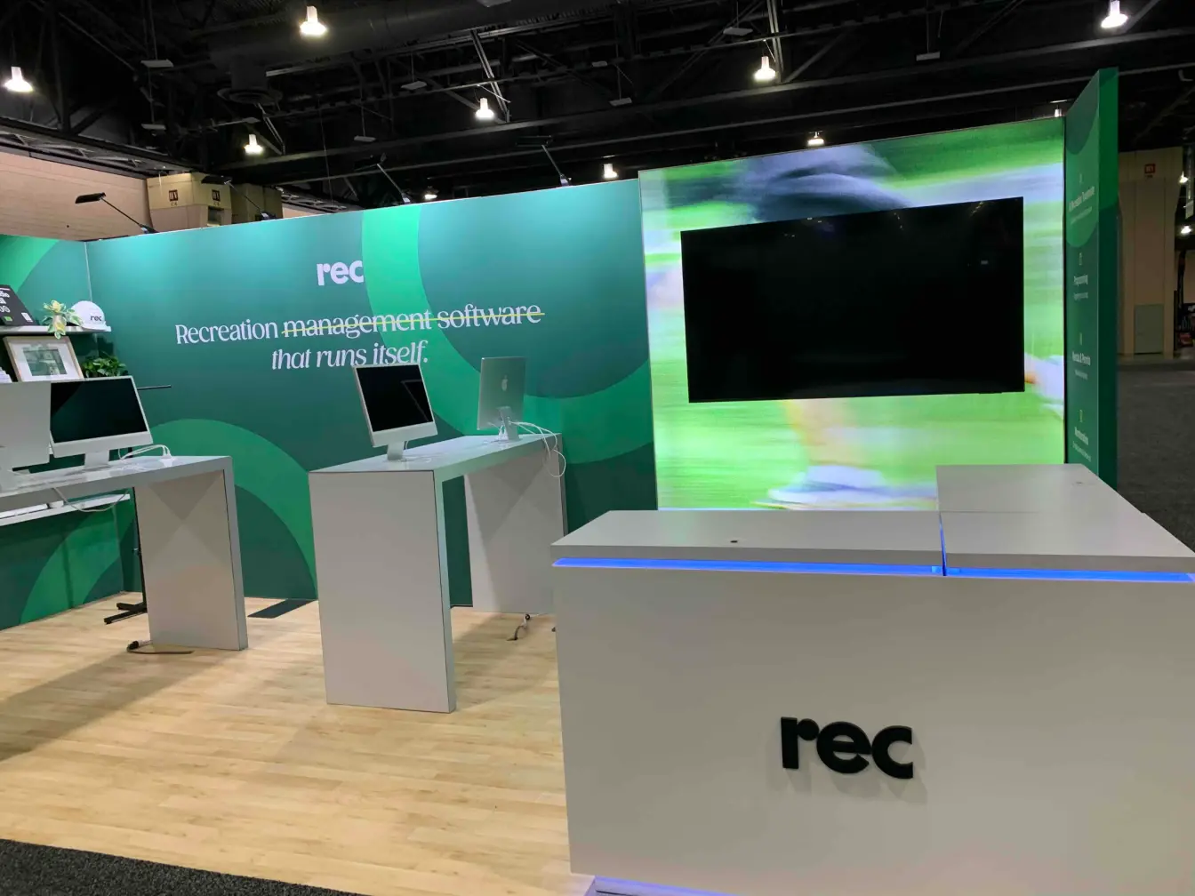Angled view of illuminated reception counter and demo area