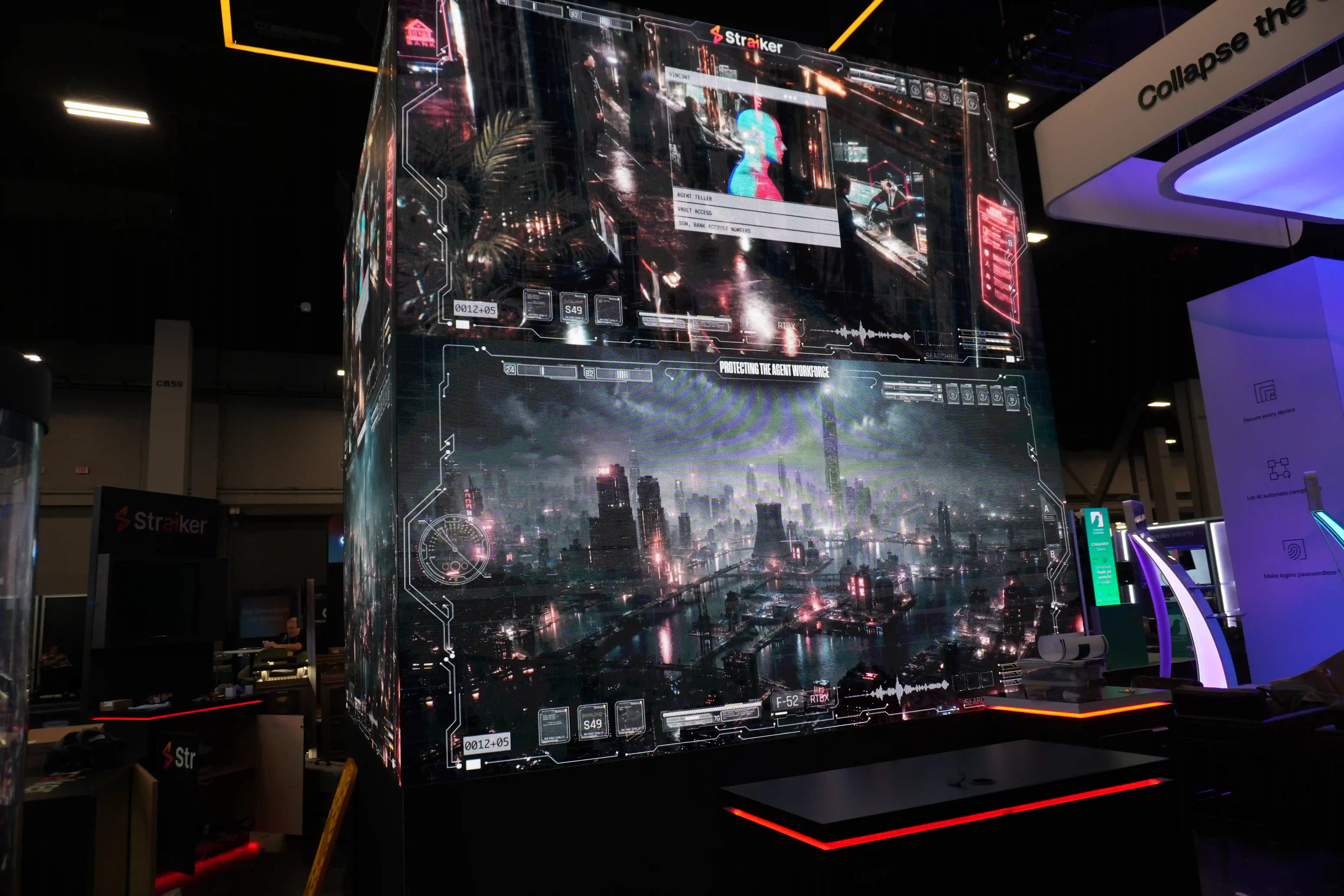Straiker AI custom trade show booth featuring illuminated LED video tower display and overhead hanging sign at Black Hat USA.